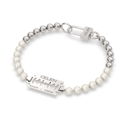 Razor blade pendant necklace and bracelet set adorned with synthetic pearls and stainless steel beads.